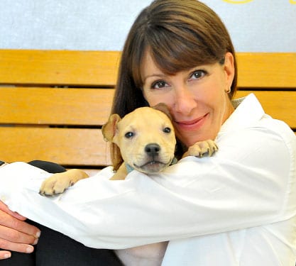 Leslie Granger holding a dog